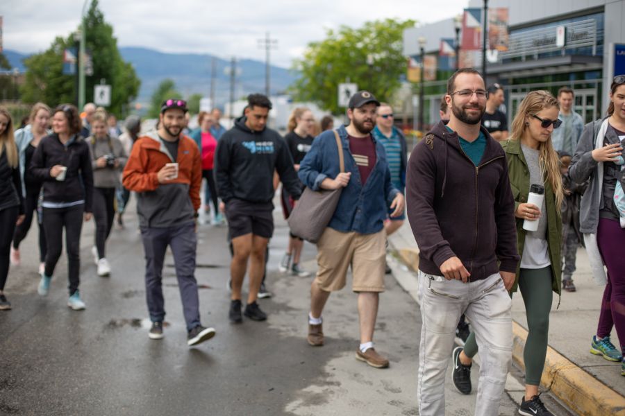 Group of people walking on sidewalk